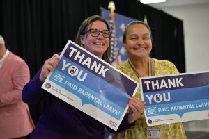 PEF members with signs supporting Paid Parental Leave.