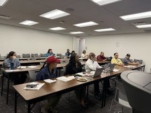 PEF leaders seated at a table.